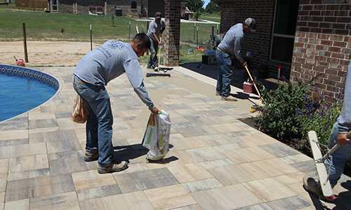 Adding Polymeric Sand to Deck