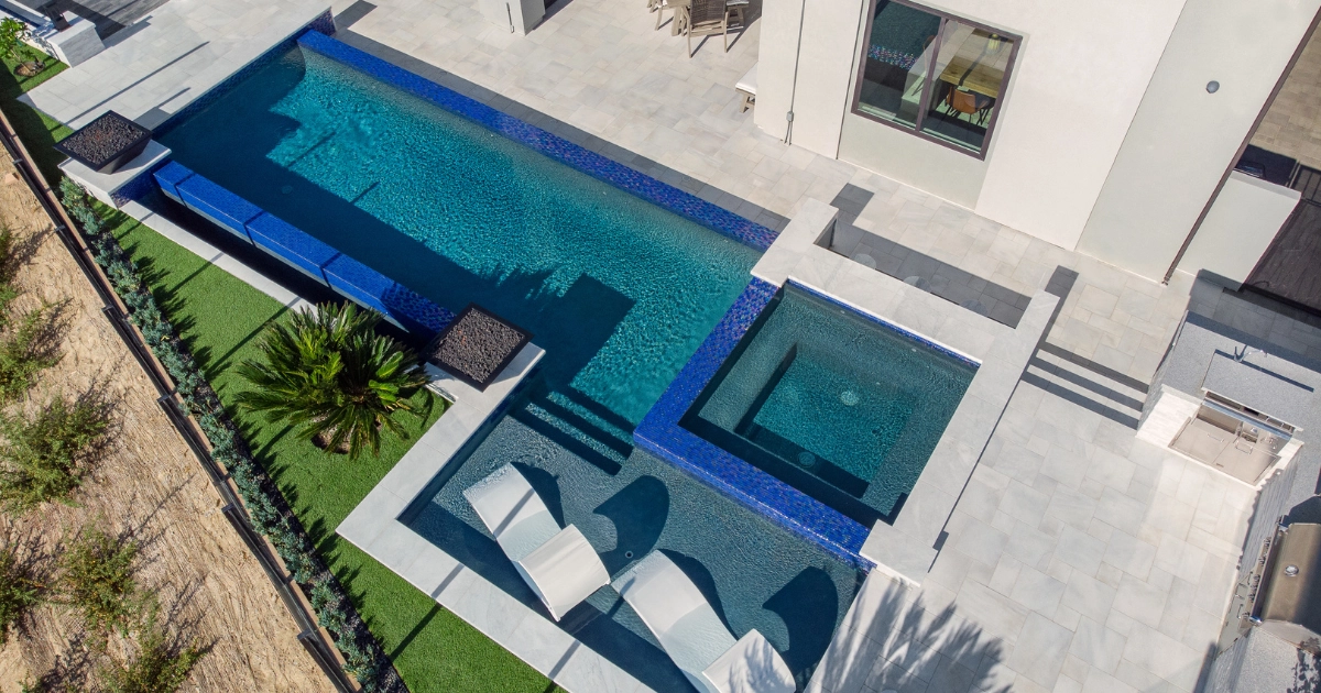 modern pool with integrated spa and fire features