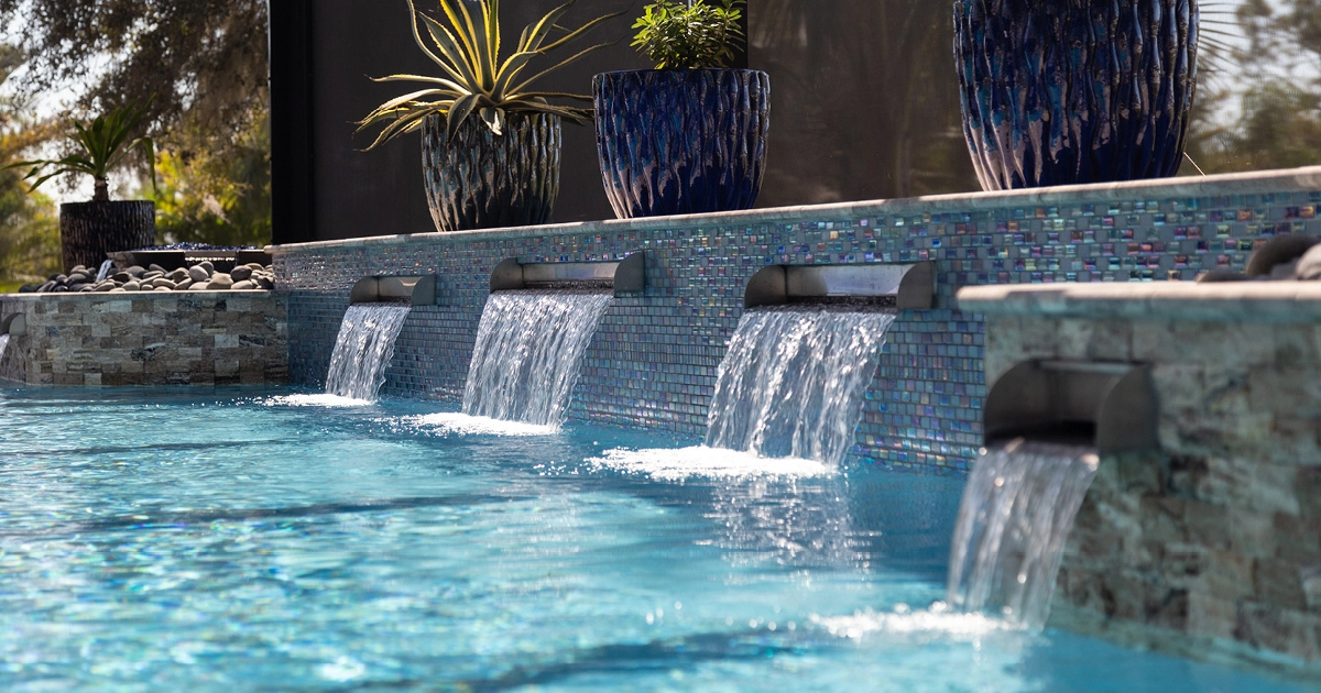 swimming pool with retaining wall and scuppered waterfalls